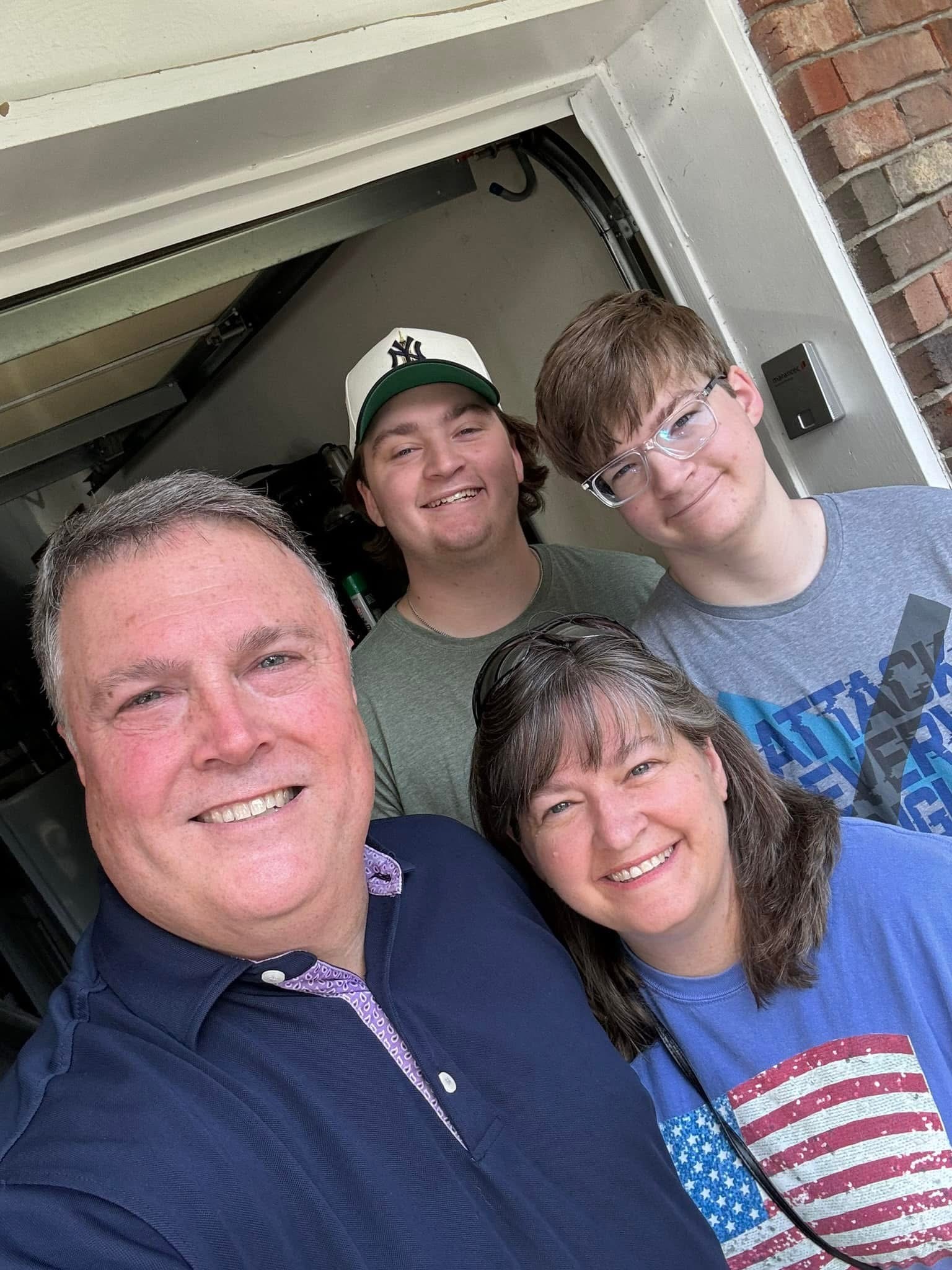 Jeff Elmore with his wife Michelle and their two sons.